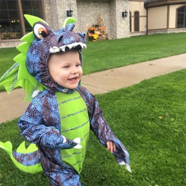 Toddler in dragon costume at Halloween Hoopla