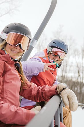 women riding the chairlift