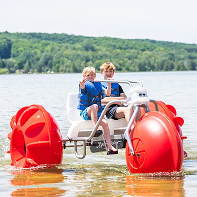 Kids riding an aqua cycle