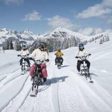 Moonbike riding through deep snow