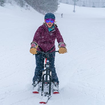 Sno-Go biking on downhill terrain