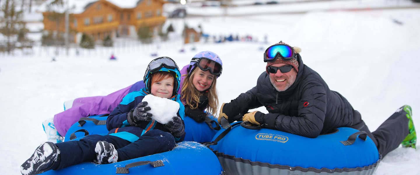 Couple drinking champagne by Pool at Boyne Mountain Resort