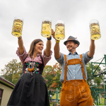 A couple Steinholding at the 2021 Skitoberfest.