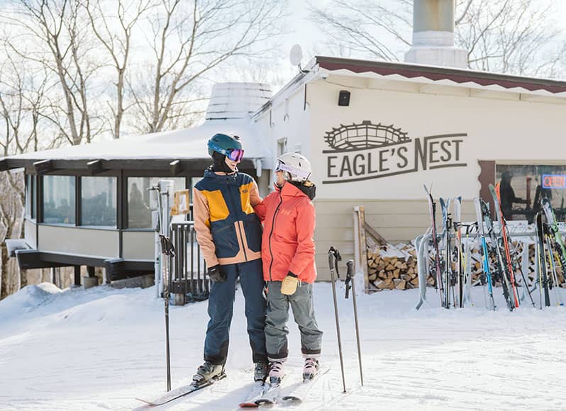 Couple drinking champagne by Pool at Boyne Mountain Resort