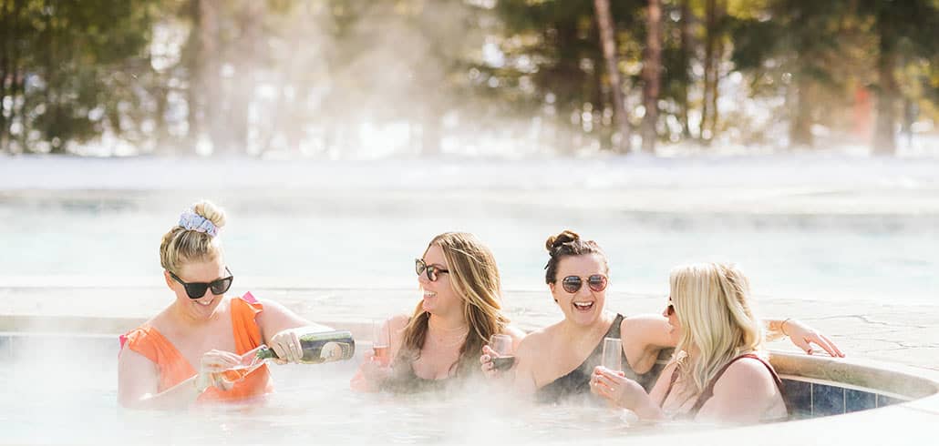 Couple drinking champagne by Pool at Boyne Mountain Resort